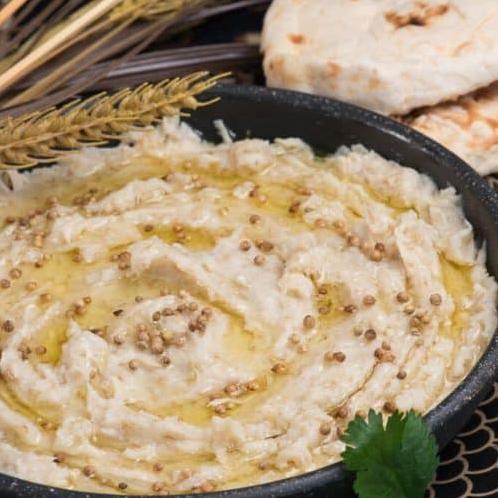  A piping hot serving of Al Harees, rich with the flavors of Middle Eastern spices