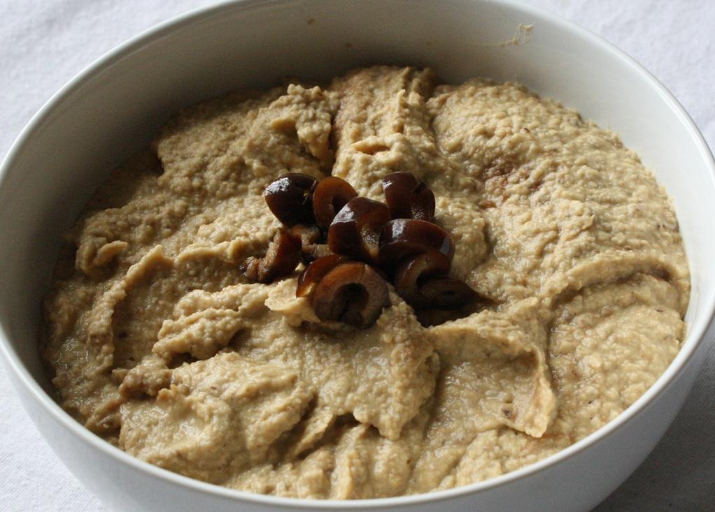  Elevate your hummus game with black olives!