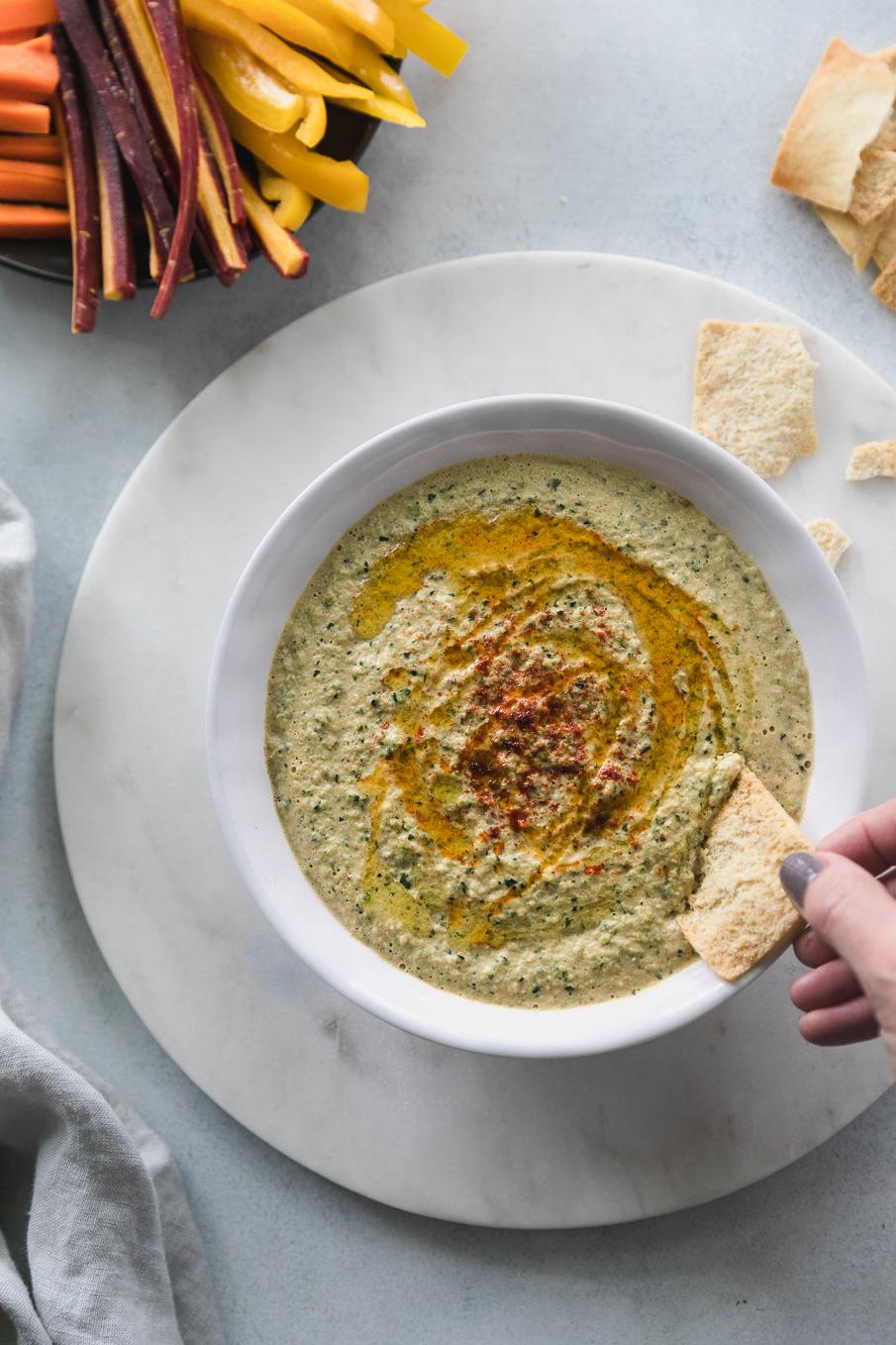  Grilled zucchini takes humble hummus to the next level.