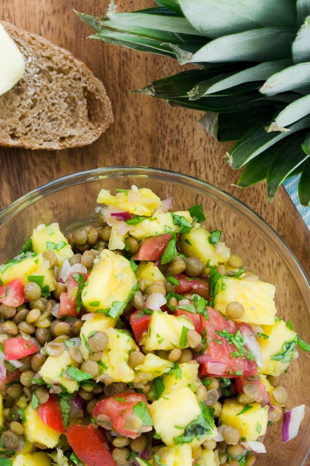  Packed with plant-based protein from lentils and bursting with juicy chunks of mango and pineapple, this salad is a meal in itself.