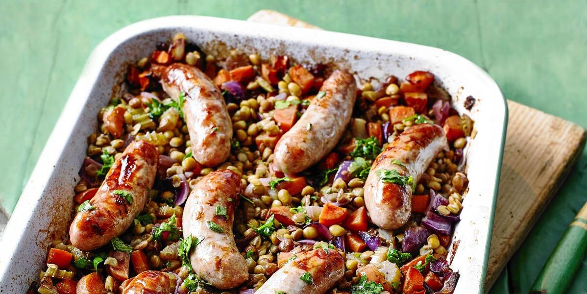  Perfectly cooked Lincolnshire sausages resting on a bed of lentils and aromatic veggies.