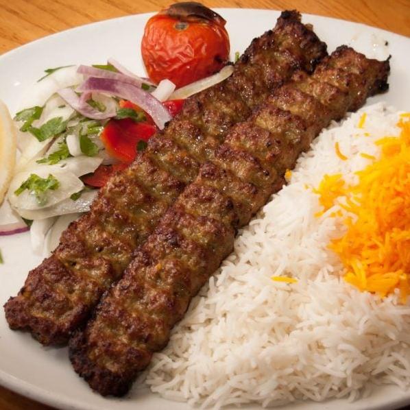  Smoky and succulent beef kabobs served on fluffy Persian rice