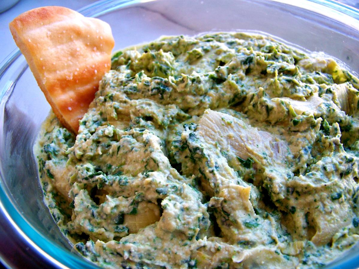  With its irresistible texture and earthy flavors, this spinach-artichoke hummus will become a go-to dip for all occasions.
